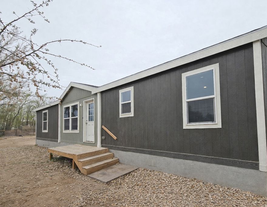 Welcome to this 2023 manufactured home in Myton, Utah, offering 3 bedrooms, 2 bathrooms, and 1,152 sq ft of single-level living.  This home is in excellent, like-new condition and is move-in ready. The interior provides a functional layout with comfortable living space, and all kitchen appliances are included. Situated on a .17-acre lot, the property features a fully fenced yard with manageable space-ideal for buyers looking to create their own landscaping, parking, or outdoor living area. Conveniently located approximately 10 minutes from Roosevelt and 15 minutes from Duchesne, offering easy access to local amenities while maintaining a small-town setting. No HOA. Buyer to verify all information