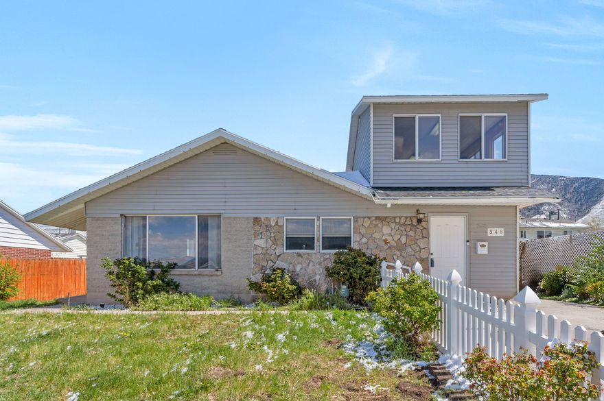 Welcome to this cute home in a great Tooele neighborhood, offering the perfect blend of small-town comfort and easy access to Salt Lake City. With 4 bedrooms and the potential for a 5th upstairs, this home provides flexible space to fit your needs.  Inside, you'll find a large living room, a big kitchen, and a spacious dining area-perfect for gathering and everyday living. A second family room downstairs offers even more room to relax, entertain, or spread out.  Enjoy outdoor living with a large covered patio-ideal for relaxing or hosting-along with a partially fenced backyard. The detached 1-car garage adds convenience, while ample storage throughout the home keeps everything organized.  You'll love the peace of mind that comes with a newer roof, along with the home's proximity to schools, shopping, and dining. This is a wonderful opportunity to enjoy space, comfort, and community at a great price!