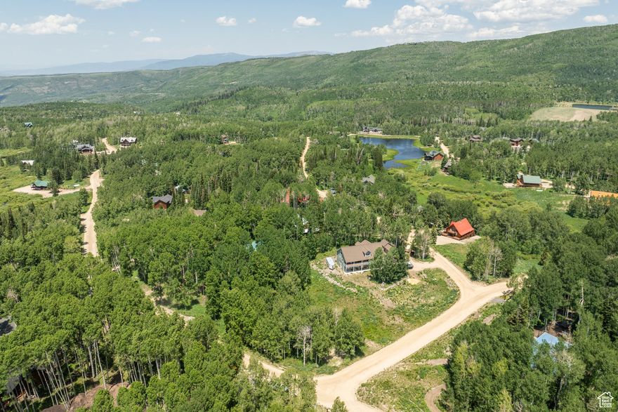 Your Dream Mountain Retreat Awaits!! Nestled in the serene beauty of Upper Timber Lakes, this stunning wooded lot offers the perfect setting and canvas for your dream mountain home.  Surrounded by tall, graceful aspens, the lot offers a tranquil escape from the hustle and bustle of everyday life.  The lot is ready to build, with plans for a modern A-frame cabin included, alongside structural plans, a site plan, septic plan, and a lot survey. Exterior and interior renderings are provided to offer a vision of your future getaway in this peaceful, wooded enclave. Lot Features & Plans:  *Surrounded by mature aspen and pine trees  *Modern A-frame cabin plans (exterior and interior renderings available)  *Structural plans, site plan, septic plan, and lot survey included  *HOA-maintained, plowed roads for convenient year-round access Timber Lakes is a private community that provides year-round access, making it the perfect place to escape in all seasons. The lot offers ample opportunity to enjoy nearby snowmobile trails, hiking paths, wildlife sightings, nature walks and lake activites. Close to downtown Heber, Midway, and Jordanelle Reservoir for boating, fishing, and water recreation. Just a short drive to Park City for world-class skiing, mountain biking, and shopping Whether you're seeking winter adventures or a peaceful summer retreat, this lot in Timber Lakes offers the ideal backdrop to build your perfect mountain escape!