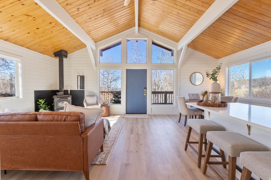 Escape to mountain perfection in this fully renovated, single-level cabin on nearly one flat, usable acre in Timberlakes. Thoughtfully updated from top to bottom, it features new appliances, furnace, plumbing, and a new septic leach field for truly worry-free living. The open-concept design centers around a beautiful kitchen island and farmhouse sink, creating the perfect gathering space. With two stunning bathrooms-one showcasing a walk-in shower with a frameless glass surround-comfort and style are everywhere you look. Step outside to the wraparound deck and take in the peaceful forest views. Blending modern luxury with mountain serenity, this low-maintenance retreat is ready to be your perfect escape in every season.