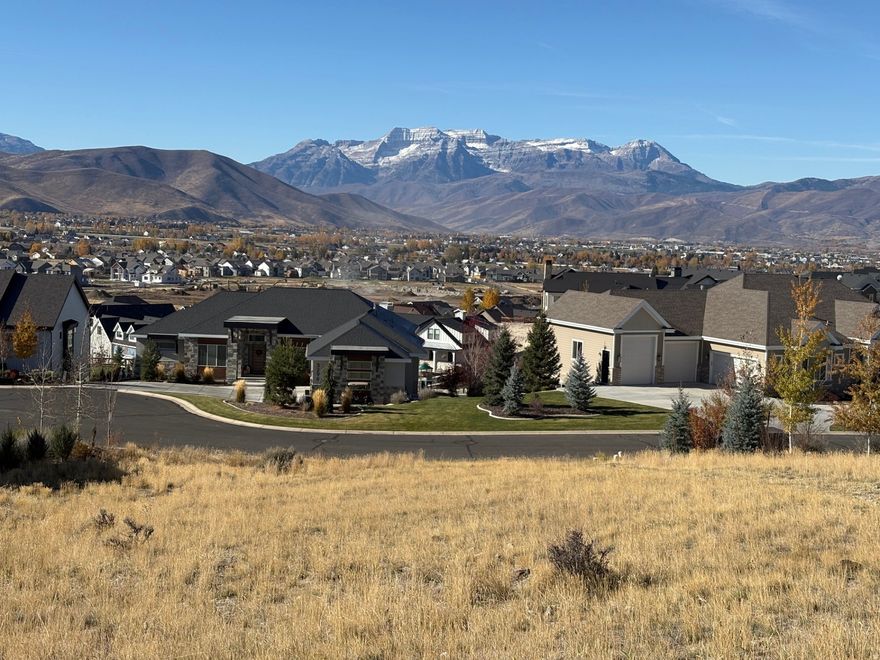This stunning view lot is the perfect opportunity to build your dream home. Located in a cul-de-sac within The Crossings development with breathtaking mountain views and a peaceful, serene setting. 50 minutes to Salt Lake City, 45 minutes to Provo and just 20 Minutes from Park City. Beautiful community with pond, trails, picnic/park area.