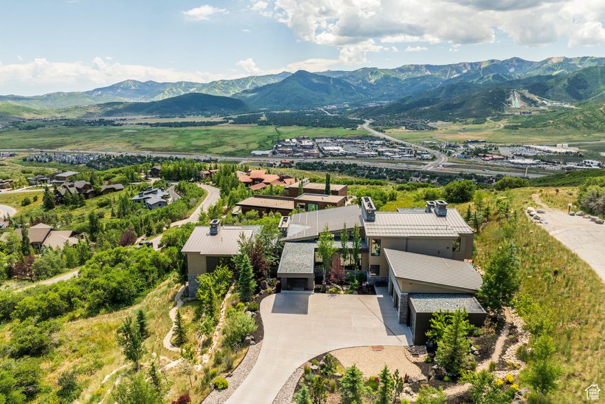 Located in beautiful Glenwild, home of Utah's Number 1 golf course year after year. Modern yet timeless, this 6 bedroom, 8 bathroom contemporary masterpiece includes 2 Master suites with one on the main level and all bedrooms feature en suite bathrooms. Enjoy some of the best panoramic views Park City has to offer. From the Utah Olympic Park to Deer Valley Ski Resort and everything in between you will see it all from this magnificent and private homesite. The open and airy layout has floor to ceiling glass, large sliders and 3,300 square feet of deck space blending the indoors with the outdoors in almost every room of the house. Thoughtfully designed with high end finishes, this home is built for entertaining while maintaining an intimate feel throughout.
