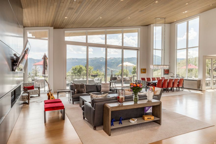 Located in beautiful Glenwild, home of Utah's Number 1 golf course year after year. Modern yet timeless, this 6 bedroom, 8 bathroom contemporary masterpiece includes 2 Master suites with one on the main level and all bedrooms feature en suite bathrooms. Enjoy some of the best panoramic views Park City has to offer. From the Utah Olympic Park to Deer Valley Ski Resort and everything in between you will see it all from this magnificent and private homesite. The open and airy layout has floor to ceiling glass, large sliders and 3,300 square feet of deck space blending the indoors with the outdoors in almost every room of the house. Thoughtfully designed with high end finishes, this home is built for entertaining while maintaining an intimate feel throughout.