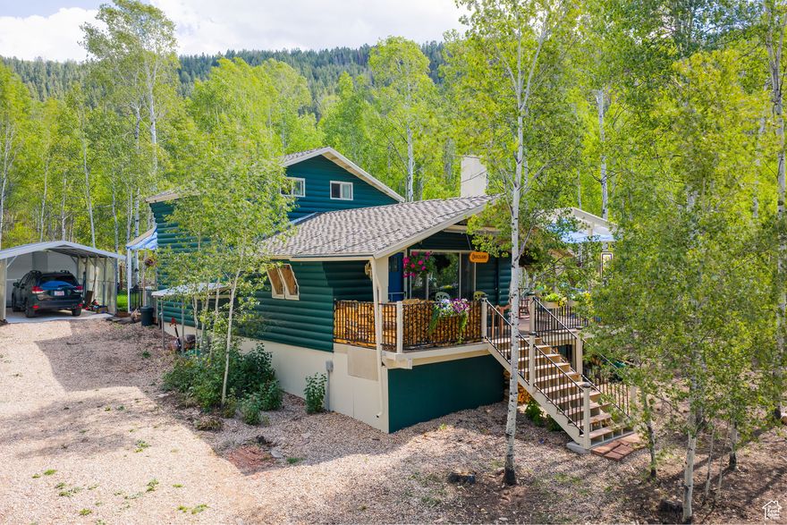 Experience serene and quiet living in a prime location with year-round access, nestled in the Weber Canyon community of Meadowview, Oakley, Utah. This beautifully updated cabin, set on a lush 0.59-acre lot, blends rustic mountain charm with modern comfort across 1,046 sq. ft. of living space, featuring 2 bedrooms with 1.5 baths. Over $150,000 in thoughtful improvements have transformed this retreat. Major upgrades include a new 150-amp electrical system with washer/dryer hookups, garbage disposal, ductless multi-zone heating and cooling, radiant heated floors, and a crawl space heater to protect pipes. Plumbing updates include a new deep water line, pressure valve, and the addition of an upstairs half bath. A custom spiral staircase replaces the old wooden ladder, adding both function and style. The exterior is equally impressive, featuring a spacious 500 sq. ft. covered wraparound porch with lighting and outlets, leveled driveway access, and extensive landscaping. A cedar greenhouse with electricity, sprinkler and drip systems, sod, and a fenced dog enclosure create a perfect outdoor oasis. Situated in an enviable location, this home offers easy access from the gated community entrance, pristine reservoirs, and endless outdoor recreation-ideal for nature enthusiasts and adventure seekers alike. This is more than a cabin-it's a turnkey lifestyle retreat in the heart of Weber Canyon, where every detail has been upgraded for comfort and convenience.