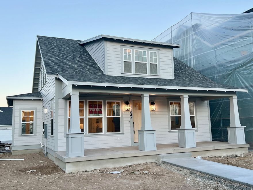 This brand new home is under construction an estimated to be complete January 2026. This home is located on Daybreak coveted Island. One of the last homesites being built. This home features the Primary Bedroom on the main floor with laundry hook ups in the WIC. Fully finished basement w/wet bar, theater room & 10' ceilings!