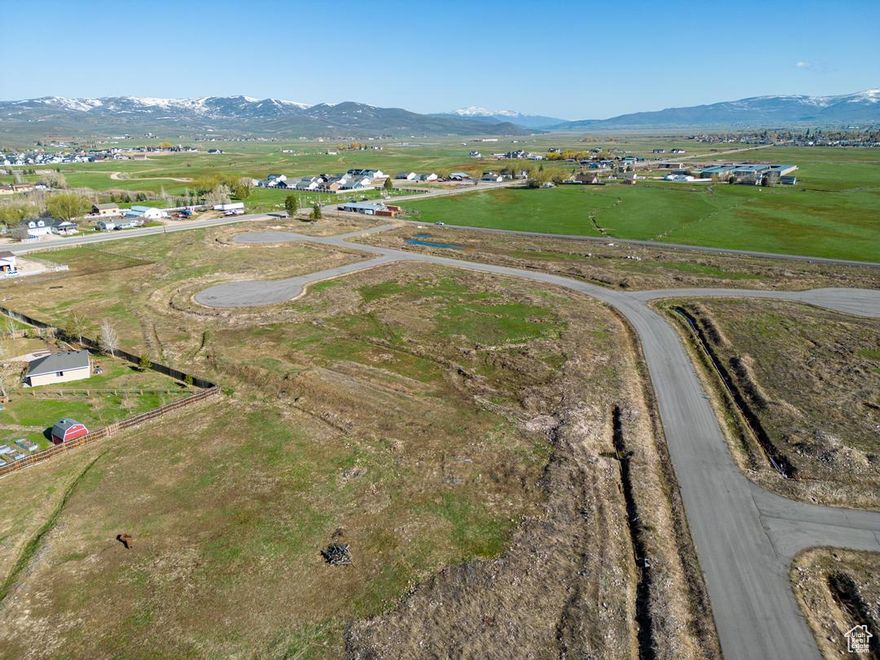 **Big Price Reduction** Discover Circle T. Ranches, an exquisite new development nestled in the heart of Francis, within the picturesque Kamas Valley. Embrace the extraordinary development opportunity of Phase 1, spanning an impressive 24 acres and offering 37 sprawling custom home lots ranging from .36 acres to .81 acres. This remarkable parcel of land boasts an ideal location, providing convenient access to the majestic Uinta Mountains and the scenic Wolf Creek Pass. Francis, a vibrant and flourishing city, has become a sought-after destination for those seeking respite from the city's inversion and congestion, reveling in the fresh mountain air. Experience the charm of a close-knit community, where neighbors still exchange warm greetings, take the time to chat, and inquire about each other's day. Life in Francis unfolds at a leisurely pace, allowing you to savor the simple joys and partake in cherished traditions such as rodeos, the grandest city-sponsored bonfire, and an exuberant Halloween celebration reminiscent of the vibrant spirit of the 80s. For outdoor enthusiasts, Francis is an absolute paradise, serving as the gateway to an abundance of recreational activities. Engage in thrilling adventures such as hunting, fishing, camping, horseback riding, snowmobiling, exhilarating rides on your ATV/UTV vehicles, and mountain biking expeditions in the renowned Uinta Mountains. Furthermore, within a convenient 10-25 minute drive, homeowners can access world-class skiing in the Park City Mountain Resort and Deere Valley Resort. For water enthusiasts, boating at Jordanelle, is just a short distance away, Seize the unique chance to contribute to the development of Francis through this exceptional opportunity, boasting 100% Plat approval. The streets, sewer and water have been started with minimal efforts required for completion. All waters shares necessary are in hand.