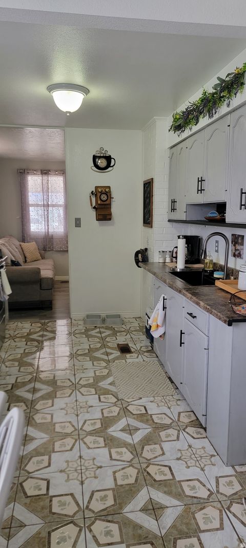 Tiny photo for 119 3RD W, East Carbon, UT 84520 (MLS # 2132903)