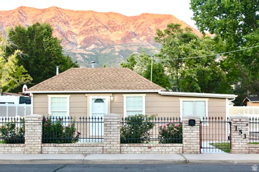 Three years ago, this cozy cottage was treated to a complete makeover. The shingles, lighting fixtures, bathroom counters and sinks, master bathroom shower, oven and range, flooring, and kitchen cabinets are all new. All of the ductwork was professionally cleaned. The master bedroom has a private bathroom and walk-in closet. The home is surrounded by a large, fully fenced yard. Automatic drip and sprinkler systems supply water to the lawns, orchard, and spacious garden area. A shed next to the home provides plenty of storage space. A towering mature tree dapples the back lawn with shade, making it a lovely place to enjoy the mountain views. The property sits in a sea of friendly neighbors and great schools. Sundance ski resort is a fifteen-minute drive. Orem City Library, the weekly Orem Farmer's Market, and The Shops at Riverwoods are all within walking distance.