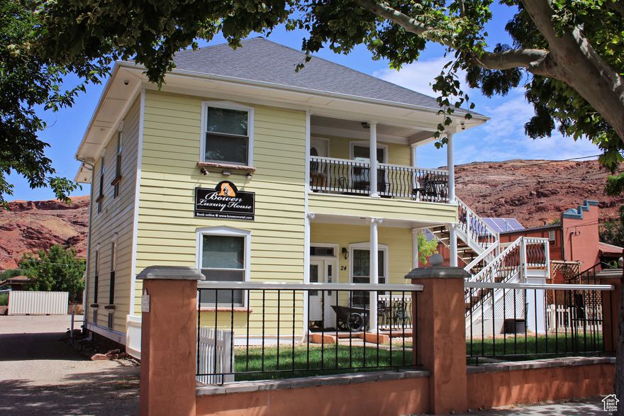 Located in the heart of downtown Moab, The Bowen Luxury House presents a unique opportunity to own a fully operational overnight rental property with additional development potential. This charming 5-bedroom, 5-bathroom home operates as a whole-house vacation rental and is ideally zoned (C-3) for commercial uses, just steps from Main Street and Moab's most visited attractions.  The home features five bedrooms, all with en-suite bathrooms, a full kitchen, and an inviting layout across two stories and is offered fully furnished. While the lot offers a bonus of approximately 0.30 acres of excess land at the rear of the house-offering ample opportunity or a redevelopment project in line with the commercial zoning. On-site parking, utility access, and minimal landscaping add to the ease of operations.  Don't miss this rare opportunity to own a piece of Moab's thriving hospitality scene with room to grow. Listing also published to residential MLS #2109723.