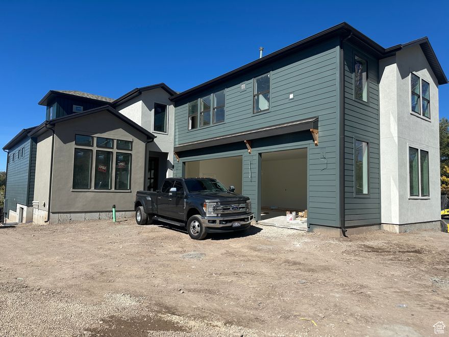 This Millcreek masterpiece has been professionally designed, both inside and out, for true luxury enjoyment.  The ability to have an ADU apartment with separate entrance, but also easily integrated into the main home through a hallway, allows the spaces to be locked-off as needed (see ADU section for details).  Metal seam siding ads to the overall fees and modern style of the home.  Design elements have been included in the photos to show the overarching style included in this home at every turn.  This home is under construction with anticipated completion of Fall 2025.  There is NO HOA