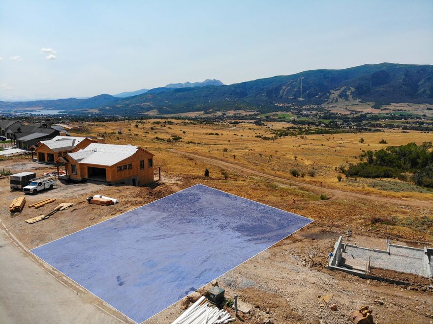 Future development in the Bridges community is currently on hold, making this one of the last ready to build view lots in the desirable Bridges community! Beautiful downhill lot located in the Wolf Creek Resort area. ZONED FOR SHORT OR LONG-TERM RENTALS. WATER AND SEWER CONNECTION FEES PAID, a $42k value! Buyer can choose a pre-approved plan for this lot or bring their own custom design, pending approval by architectural design committee. This Bridges lot offers amazing, unobstructed panoramic views of the valley floor, surrounding Wasatch mountain range and Nordic Valley Ski Resort, which is stunning when it's lit for night skiing! Only minutes from miles of mountain biking and hiking trails, Wolf Creek 18-hole golf course, Pineview Reservoir, fishing, boating and much more. Landscaping to be installed by the Bridges Developer and paid by Buyer, it is not included in the price of the lot. The landscaping maintenance and secondary water will be provided by The Bridges HOA and included in the monthly HOA fee.