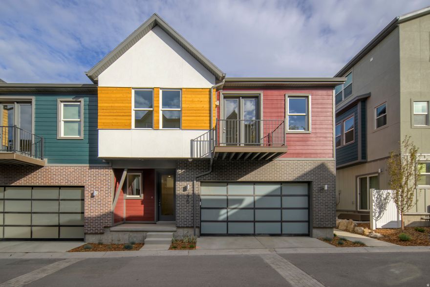 Location! Location! Location! Welcome to Bishop Place in Salt Lake City's historic Marmalade District. Steps from cafs, the Marmalade Library, Delta Center, Pioneer Park, and city streets-and a short walk to holiday events downtown. Easy access to City Creek, Temple Square, The Gateway, I15, I80, and just 10 minutes to the airport.  Move-in ready and just waiting for your Christmas tree.  This efficient townhome by Garbett Homes features solar-E windows, advanced insulation, air recirculation, on-demand hot water, and a 2-car private garage with EV charging. Inside, enjoy quartz countertops, designer tile, durable vinyl flooring, and an open-concept layout with abundant natural light. Upstairs, the private primary suite offers a retreat, while the downstairs bedroom with a full bathroom is perfect for roommates or guests.  The home comes with a full builder warranty, giving you peace of mind with a brand-new home. Schedule a visit today!