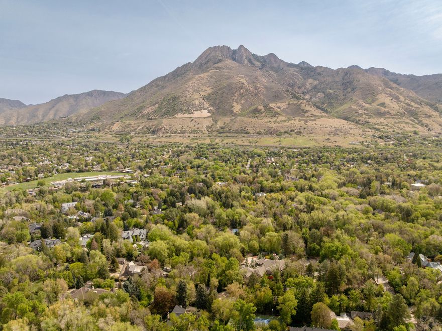 Two acres (apx) on the best spot of Walker Lane. Flat, site prepped and ready for your buyers dream home! The ultimate situation with breathtaking mountain views, wooded adjacent properties and a feeling of country charm! This location and ambiance make this a truly rare find. Two water shares are included. Quick access to Holladay Village, Union Park, great schools, and several freeway access points.