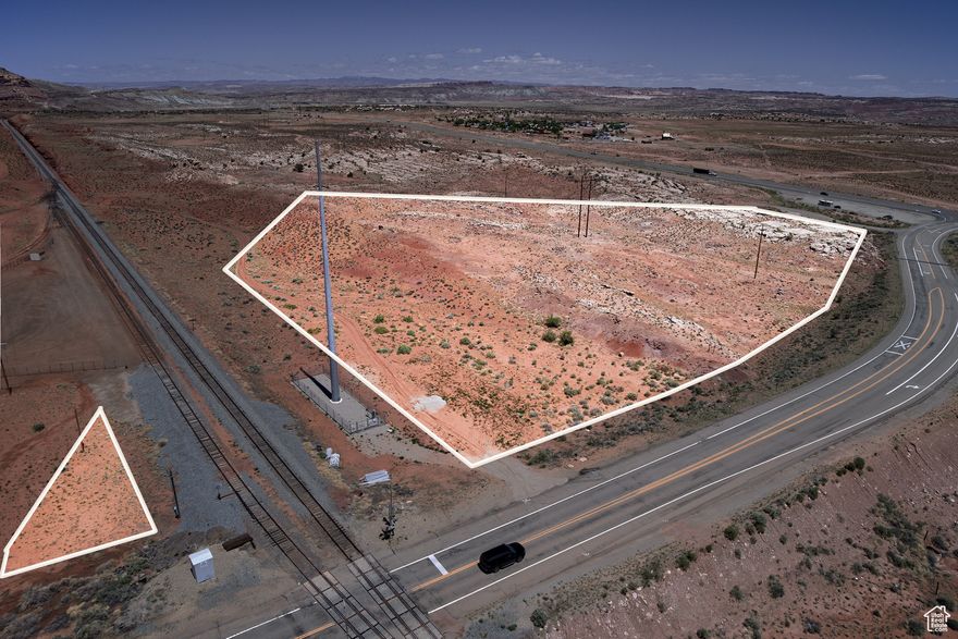 Join the likes of the Moab Giants, The Red Earth Venue and the Rocky Mountaineer at the gateway to Moab!  This is a perfect location to realize your dream - build it here! Directions: from Moab, north on Hwy 191 to Dead Horse Point State Park turnoff Hwy 313. Turn left on to Hwy 313.  Parcel is on the right  just past the UDOT information center between HWY 191 and railroad tracks.