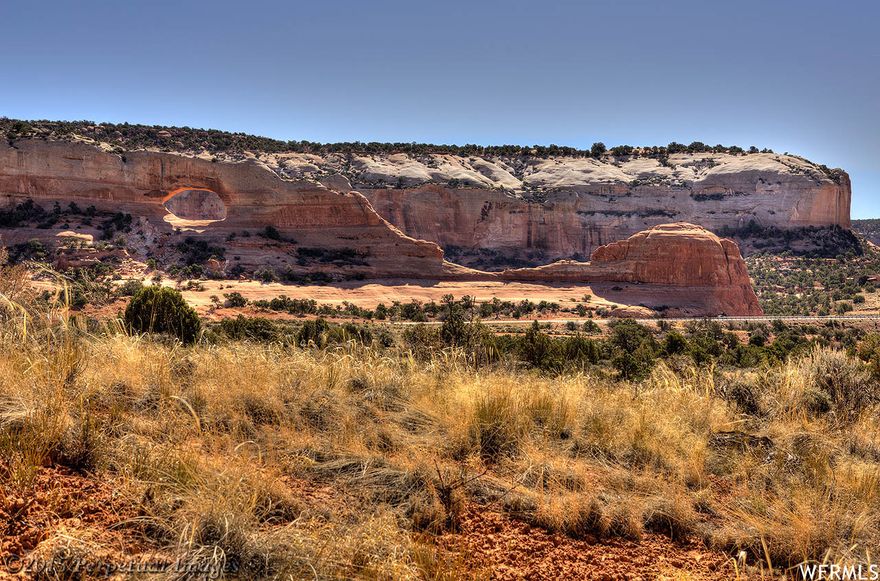 SET YOURSELF FREE- at Wilson Arch Resort Community! Exceptional commercial parcel directly across from the arch. Perfectly suited for a restaurant and includes approved plans for 6,600 sf building comprised of restaurant and gallery, excavation complete with access and loading dock off Joe Wilson Drive. Community water to the site, septic in place, underground utilities including 3-phase power. Perfect for small hotel, restaurant, gallery space, multi-family unit, or a single-family home. There are multiple commercial lots in Wilson Arch Resort that are also available to expand your commercial opportunities! CC&Rs in place to guide design standards. Fantastic stopover mid-way between Moab and Monticello, in the heart of the Four Corners Region!