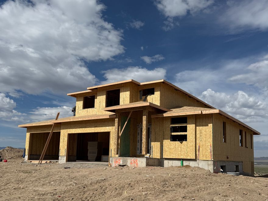 Welcome to your future home in the vibrant new Scarlet Ridge development, just minutes from Eagle Mountain City Center-offering unbeatable convenience to shopping, dining, schools, and breathtaking mountain surroundings. Right now, the seller is sweetening the deal with up to $22,000 toward rate buydowns and/or closing costs, plus a dedicated RV pad included at no extra charge.  Discover the charming Maple floor plan by Alpine Homes-your perfect blank canvas in Scarlett Ridge, Eagle Mountain! Nestled on a generous half-acre lot with a walkout basement, this brand-new home offers incredible flexibility and space. It features 4 bedrooms plus a dedicated main-floor office, 2.5 bathrooms, and a stunning two-story great room. The spacious main-floor primary suite includes a walk-in closet and luxurious bathroom with a soaking tub and separate shower. The gourmet kitchen shines with a large dining area, quartz countertops, and durable, water-resistant laminate wood flooring-perfect for family gatherings and entertaining. Enjoy the rare upgrade to a 4-car garage for all your vehicles, toys, or workshop needs. Best of all, no interior selections have been made yet-which means you get to choose everything: flooring, cabinets, countertops, fixtures, paint colors, and any desired upgrades!