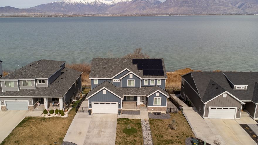 UNOBSTRUCTED VIEWS OF UTAH LAKE AND MOUNTAINS! This home was built in 2021, with vaulted & 10' ceilings. THREE car garage, with a walkout basement featuring a separate entrance and basement apartment. Large owners suite, with double sinks, large shower and walk in closet. Additional features include: GE Cafe smart connect appliances, plantation shutters and electronic window shades, solar panels & battery backup, water recirculation/instant hot water, 50 gal water heater, waterproof LVP flooring, granite countertops, large pantry, jellyfish lighting, too many extras to list! MUST SEE. Buyer to verify all.