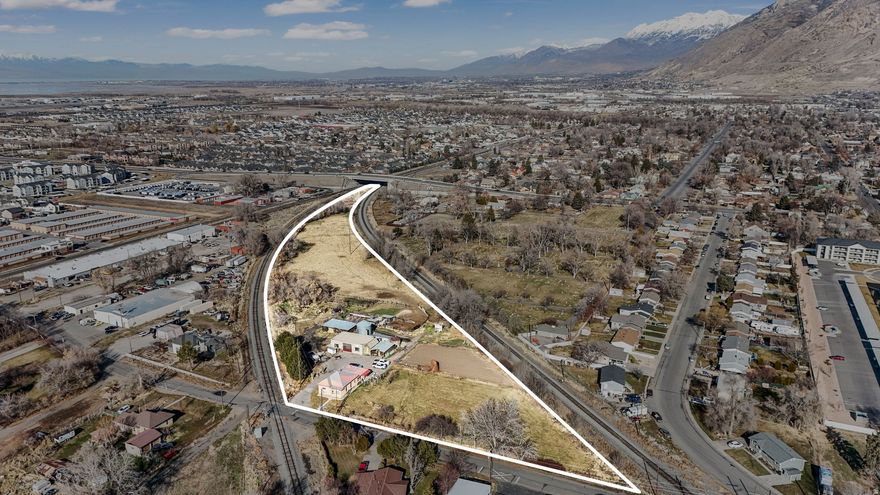 Rare opportunity to acquire 5.6 acres of L-1 Light Industrialzoned land in a central Springville location with strong access and long-term development potential. This property is being marketed for land value and redevelopment potential.  The versatile L-1 zoning allows for a wide range of commercial and light industrial uses, making this an ideal acquisition for investors, developers, and owner-users seeking flexibility and future upside.  Potential uses may include (buyer to verify):         Outdoor storage         Small storage facilities         Veterinary or animal hospital         Light industrial or service-based operations         Small multi-unit or mixed-use concepts consistent with L-1 zoning  The size, zoning, and location create a compelling opportunity for those with vision and capital in one of Utah County's expanding markets.  All information herein is provided as a courtesy only and no guarantees are made, buyer and buyer agent will need to verify everything to satisfaction.