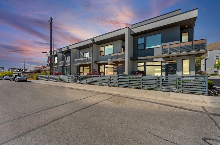 WELCOME TO THE NEIGHBORHOOD!! Welcome to this modern rooftop townhome in Marmalade, where style meets convenience. Featuring an open-concept layout, a stunning kitchen with two-tone cabinets, quartz countertops, and stainless steel appliances, plus a spacious primary suite with a private balcony and oversized walk-in shower.  Enjoy multiple outdoor spaces, including a large rooftop patio with incredible mountain and sunset views, and a gated front patio. A 2-car garage, quick freeway access, Google Fiber, and close proximity to the airport make this home as practical as it is beautiful.