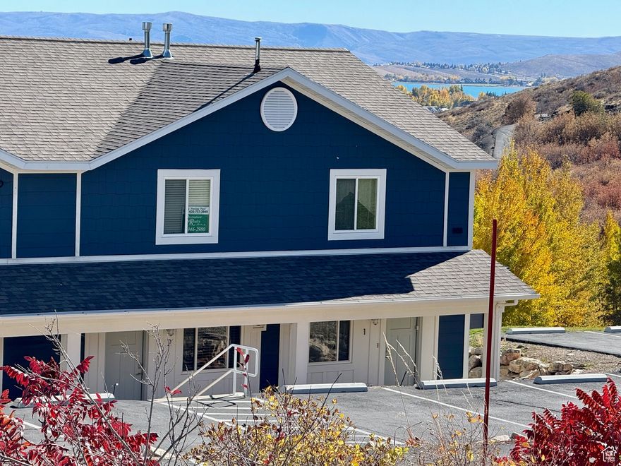 MOVE IN READY! Sold Turn-key!  Overlooking the Bear Lake State Park Marina with beautiful views of the Bear Lake and the Bear Lake State Park Marina! Enjoy 4 seasons from this beautiful condo!  A quick 20 minutes to Beaver Mountain Ski Resort and the sinks for winter fun or to enjoy the beautiful Fall colors the scenic byway of Logan Canyon offers.  Cozy up to the fire upon your return from a day on the slopes or a mountain drive.  Summer fun on the lake or a swim in the community pool or Hot tub! Relax on the patio or play on the grassy area in front. Easy access to downtown shops, restaurants and bike path!  New furnace, water heater, AC, dryer, blinds, toilets and like new carpet! Shingles and siding replace within the last 2 years. Fireplace has a pellet insert.  Not currently in the rental pool but short term rentals are allowed.  Don't miss this opportunity to start enjoying all Bear Lake has to offer! Call today!