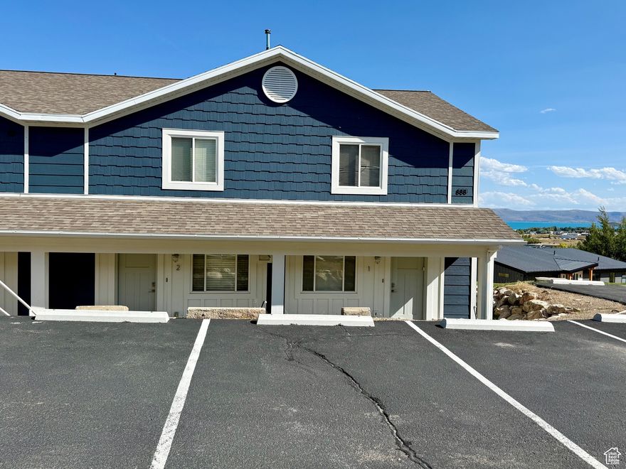 Overlooking the Bear Lake State Park Marina!  Relax on the patio or play on the grassy area in front!  Enjoy beautiful Bear Lake Sunrises and the moon as it rises over the lake! Enjoy all 4 seasons with easy access year round.  New furnace, water heater, AC. Shingles and siding replace within the last 2 years. Fireplace has a pellet insert. Close to shops and restaurants!  Furniture included (some exclusions).  Not currently in the rental pool but short term rentals are allowed.  Don't miss this opportunity to start enjoying all Bear Lake has to offer!