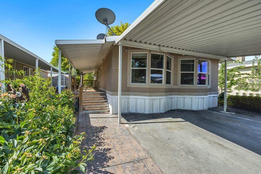 Spacious & Upgraded 3-Bedroom Mobile Home  Largest Unit in the Park! Welcome to this beautifully upgraded 3-bedroom, 2-bath mobile home offering comfort, style, and space like no other. As the largest unit in the entire lot, this home features vaulted ceilings that enhance its open and airy layout. Enjoy a range of upgrades including a stylish stucco exterior, elegant paver deck perfect for outdoor gatherings, and three dedicated parking spaces for added convenience. Inside, the primary suite is a true retreat with a large walk-in closet, and a luxurious en-suite bathroom boasting both a separate shower and soaking tub. With generously sized bedrooms, granite counter tops and thoughtful touches throughout. Don't miss out on this unique opportunity-schedule your tour today!