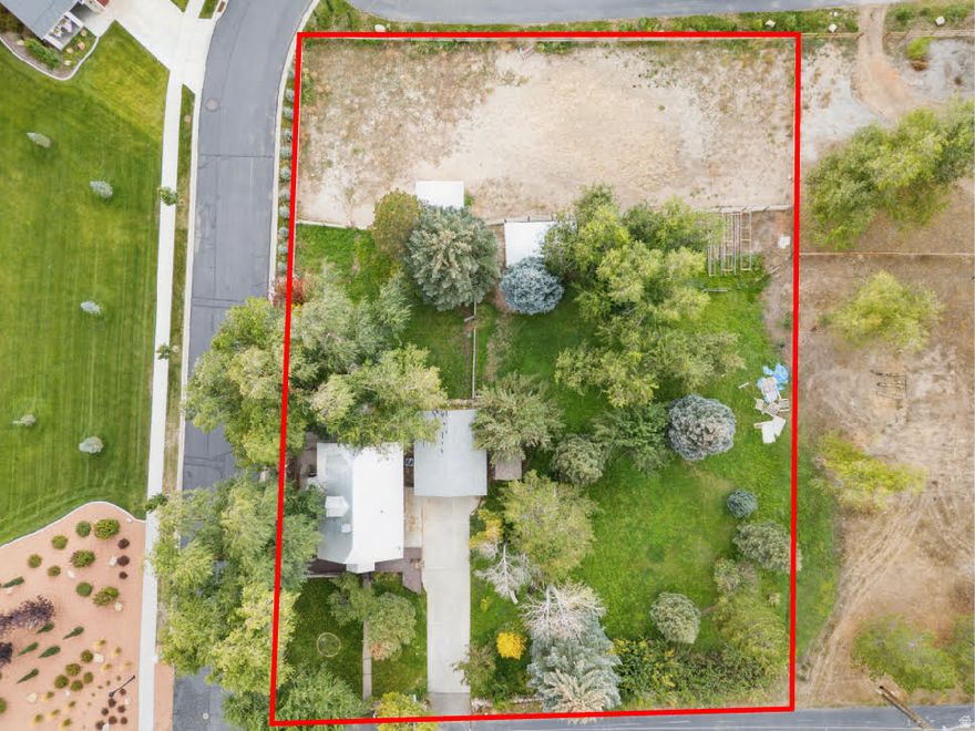 Rare horse property on over a full acre in one of Midway's most scenic spots. This corner-lot home offers unbeatable forever views of Mount Timpanogos and is just a short walk or bike ride from Midway's Main Street, Deer Creek, and nearby trails. Step inside to find bright, airy spaces filled with natural light, smart storage solutions and a main level primary bedroom. Recent upgrades include new kitchen backsplash, carpet and LVP flooring. The lower level has been thoughtfully remodeled, offering a warm and flexible space for guests, a home office, or a potential for rental income with a separate entrance and laundry area complete with an additional washer and dryer. Outside is where this home truly shines - surrounded by mature trees, fruit trees, and colorful perennials, the yard offers multiple outdoor seating areas, a cozy firepit, and space for gardening, relaxing or caring for horses in your own fully fenced horse pasture. The large lot which includes a full water share with Midway Irrigation, offers endless possibilities for a future Barn, additional storage, garage space and more.  With Swiss Days, the bakery, and Main Street festivities just a short walk away, you're never far from the heart of Midway life. If you're dreaming of a place with soul, space, and story, this one-of-a-kind property might just be it.