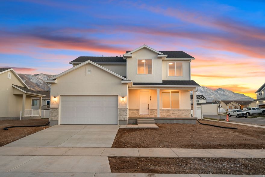 Gorgeous custom home in one of Santaquin's best neighborhoods! High end finishes, eight foot doors, walk up basement to accommodate a potential mother in law/ADU.  Quiet street, walkable to a top rated school with stunning mountain views.  Small town charm at it's finest, zero down financing available in this area.  Call today for a private tour!  Lots/plans available for a custom construction in this community.