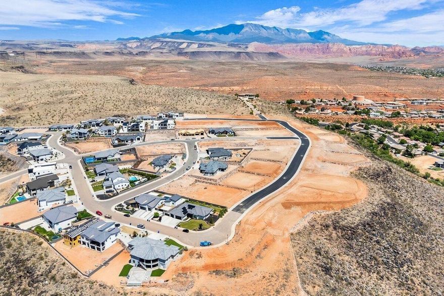 Interior view lot with exceptional views overlooking the city, mountains, Pine Valley, red rock mesas, Sand Hollow, and even Zion National Park! Best suited for a rambler floor plan, this lot is located in the final phase of Grand Heights, the highest elevated subdivision in St. George proper, nearly 500 feet higher than the rest of town, including Stone Cliff and Foremaster, offering unmatched views. Enjoy quick access to downtown, hiking and biking trails, and off-road adventures, plus you're just 15 minutes from two major fishing reservoirs and over half a dozen top-rated golf courses. With BLM land bordering the subdivision, you can ride bikes and ATVs straight from your doorstep. Numerous oversized lots are available with convenient highway access. Bring your own builder! Buyer is responsible for water impact fees. All construction requires prior review and approval by the architectural control committee. Buyer to verify all information, deemed reliable, however buyer to verify all info including utilities & ACC information if applicable.