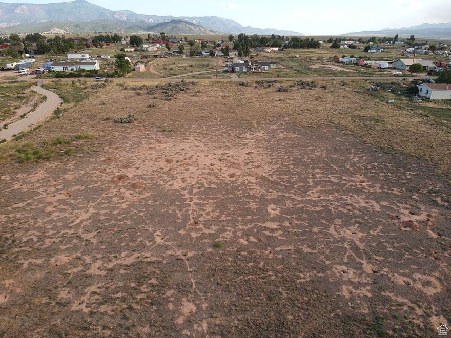 Discover an exceptional opportunity to build your dream home on this spacious 2.26 Acre nestled in a peaceful rural setting on the outskirts of Cedar City. Located in a growing area with mountain views and easy access to town, this level parcel offers plenty of room for a custom home, shop, or animals. The lot features open terrain, ideal for development, with utilities nearby. Enjoy quiet country living with no HOA and the freedom of wide open space, while still being close to shopping, and Highway 56 for commuting convenience. Whether you're looking to build now or invest for the future, this property is full of potential. Water meter already installed $4,800 value. water is a flat $40 monthly fee paid to the Meadows Ranch Water Company.