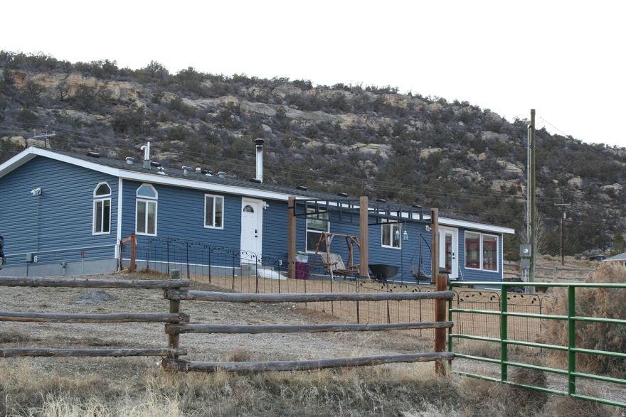 Beautiful remodeled 1836 sq ft home nestled in scenic Dry Fork Canyon.  This horse property features a barn, chicken coop, Multiple out buildings and sheds, and a spacious 3-car garage.  Enjoy open space, updated finished and the peaceful country living. Plenty of room  for animals, hobbies and outdoor adventures on 5.21 acres