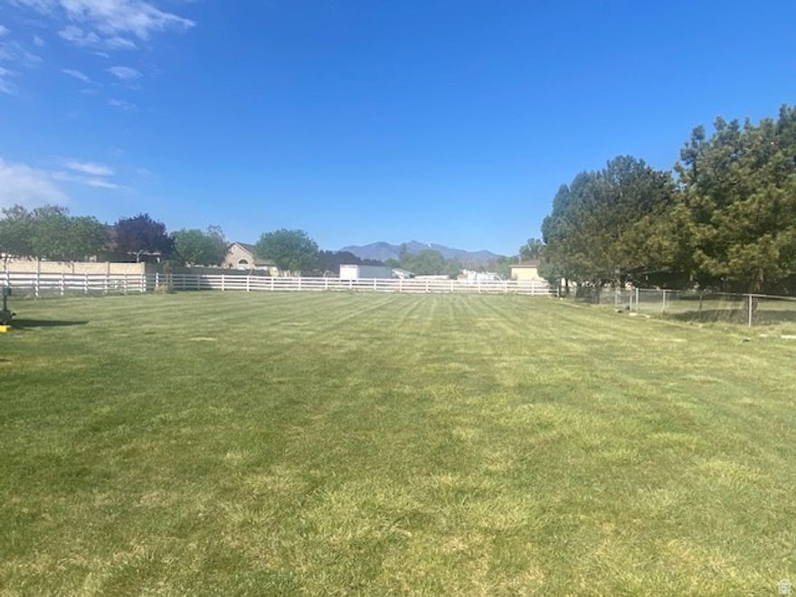 Looking for a gorgeous lot to build your forever home on?  This rare and beautiful 1/2 acre horse property is tucked away in a lovely established West Jordan neighborhood.  With views of the Wasatch front and surrounded by a quiet rural atmosphere - it's hard to believe that it's just minutes from great shopping and an easy commute to anywhere in the valley.  It's such a fantastic opportunity to  own your own little piece of heaven in the middle of the Salt Lake Valley.  Come and see it today!