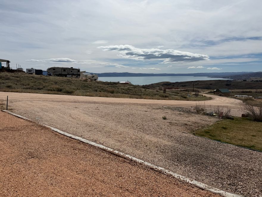 Beginning of season deal!! Improved RV lot with beautiful Bear Lake and mountain views! Water and power already installed on the property, and lot was just leveled, fully graveled, with a retaining wall in place. Ready to be enjoyed now! Sewer dump station located front of the park. Nearly the same price as other unimproved lots without views! 40 foot 2019 Pioneer 5th wheel on lot available for extra. Ask listing agent for more details. Jump on it today!