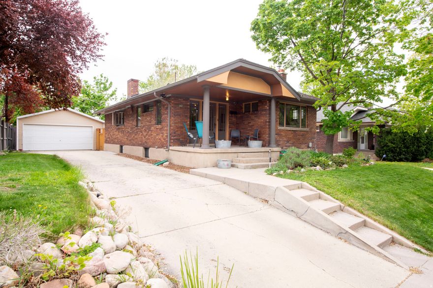 Charming Arts & Crafts brick bungalow in the highly sought-after 15th & 15th neighborhood. The inviting front rooms showcase original gumwood moldings, built-in bookcases, a classic tile fireplace, and beautiful hardwood floors-preserving the home's historic character.  A thoughtfully remodeled, period-appropriate kitchen features custom shaker-style cabinetry, quartz countertops, a subway tile backsplash, stainless steel appliances, and hardwood flooring. The stunning main bathroom offers a vaulted ceiling, skylight, subway tile surround, and a custom vanity with quartz countertop.  The professionally finished basement provides a comfortable family room, a tastefully updated bathroom, and a finished laundry area. A dedicated home office offers flexibility and could be converted into a third bedroom if needed.  Additional highlights include a large two-car garage and a private, fenced backyard.  Ideally located within walking distance to the vibrant 15th & 15th commercial district, with its restaurants, bookstore, art gallery, and gelato, plus a nearby neighborhood market. Enjoy one of Salt Lake's most walkable neighborhoods, rich in charm and character.