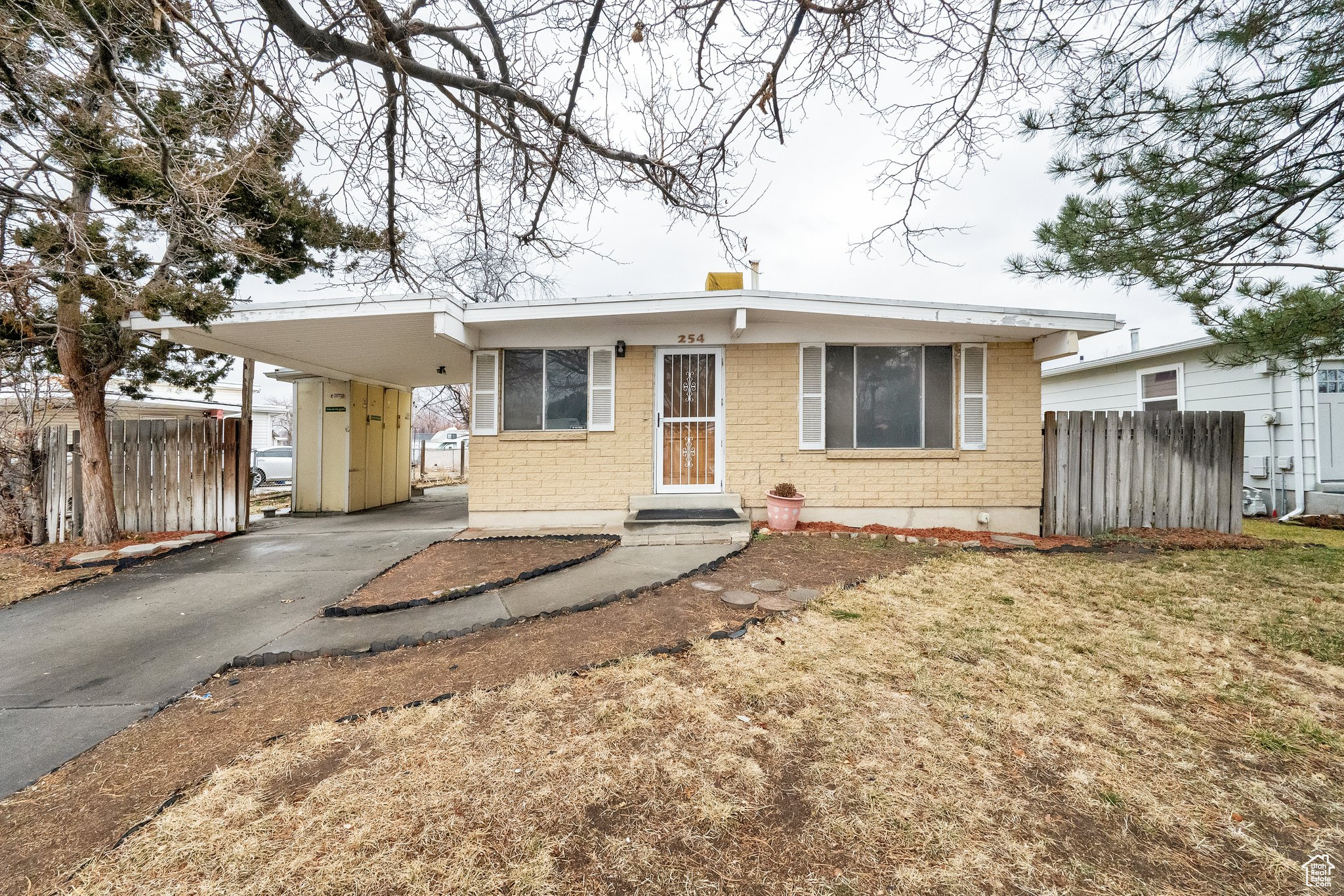 Great bones! New carpet, new paint. Adorable little house! Lots of potential. Furnace and water heater replaced around 3 years ago. Large backyard with plenty of room to grow. The carport area can fit 2 cars tandem, or possibly be made larger. (Depending on local zoning.)