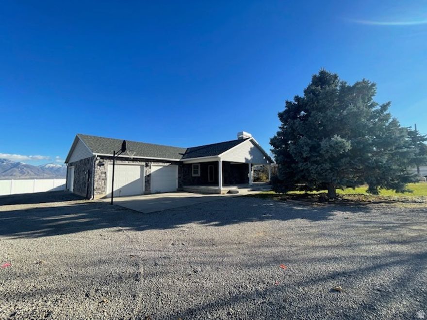 Custom Built home on .668 acre lot with Tree Lined Entrance and incredible Views of the Wasatch Mountains.  Home features natural wood cabinets, with extra cabinets for pantry and storage.  Hard wood and tile floors with heated floors in the master and downstairs bathrooms.  Vaulted ceiling, gas stove on main, and main floor laundry room.  Master suite has a separate shower tub and double sinks.  Home has 2 Bedrooms with 2 addition finished rooms that could be converted to bedrooms.  3 car garage and beautifully landscaped yard. Horses and Animals permitted. The Tax ID Number on the MLS the current Tax ID #, will not be used at closing and is for listing purposes only. Property being sold has no assigned Tax ID number and is "lot 31 of the Homestead at Butterfield Farms subdivision", a large lot Custom Home Subdivision. The plat which includes this property will be recorded in 2026. This property will be closed with a Metes and Bounds description with a lot size of .668 acres which includes the existing home. Buyers will be required to sign the Plat at Closing. Owner/agent. Call agent for details.