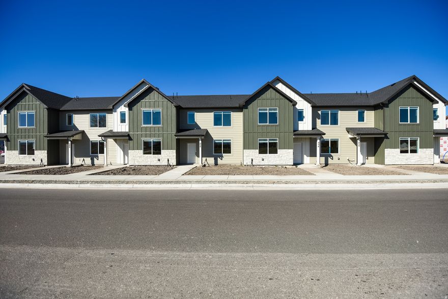 Offering $10,000 in concessions plus a washer, dryer, and fridge included!! Come and out and see them before they are gone. This townhome has a 2 car garage, a large open kitchen and living space with high quality finishes including- quartz countertops, LVP flooring, and stainless steel appliances. Upstairs you'll find 3 bedrooms, including a large master with it's own walk in closet. Enjoy all the amazing community amenities like the pavilion, pickleball courts, & playground -- all at a great price point. Enjoy beautiful views from this incredible location as well plus 4 walking trails nearby. HOA covers all exterior landscaping maintenance, exterior building maintenance, snow removal on driveways, property & liability insurance coverage, trash and 1 gig of high speed fiber internet.