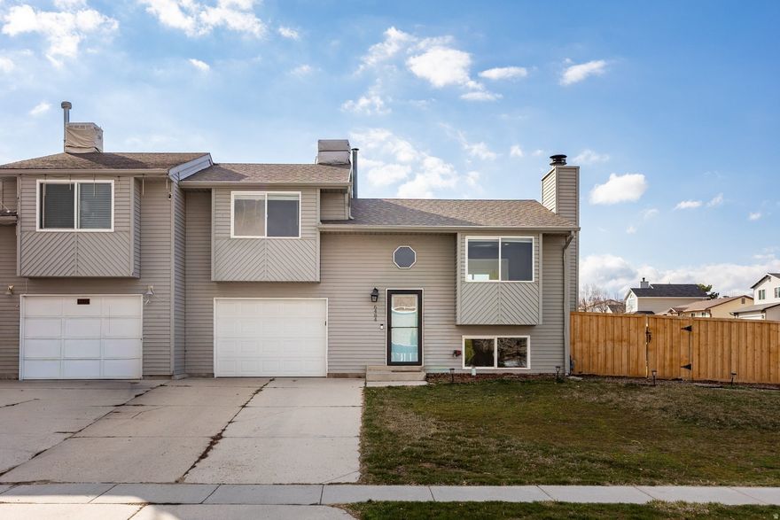 Impeccably updated twin home in Oquirrh Shadows with no HOA restrictions. Nearly every major component has been upgraded in the last five years- including roof, furnace, windows, doors, quartz countertops, appliances, flooring, carpet, paint, recessed lighting, and plumbing fixtures - offering true move-in-ready living. Oversized windows capture stunning east and west mountain views and flood the home with natural light. The extra-deep garage with workbench adds functionality, while the fully finished basement expands your living space. Enjoy outdoor living on the fully fenced corner lot featuring an RV gate and a generous deck ideal for entertaining. Prime West Jordan location close to schools, Jordan Landing, South Valley Regional Airport, shopping, dining, and quick freeway access.