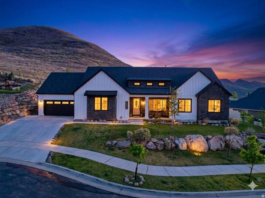 Welcome to this stunning home in Herriman, ideally located on a quiet cul-de-sac just a short walk from the Herriman Steps. Situated on .58 acres, this property offers incredible valley and mountain views with beautiful landscaping featuring Sunburst maple, spiral oak, and aspen trees. The main level boasts high ceilings and an open-concept layout centered around a gourmet kitchen with a Sub-Zero refrigerator, perfect for entertaining. The newly renovated basement includes a mother-in-law apartment with a private entrance, offering flexibility for guests or rental income.  Major upgrades provide peace of mind, including a new electrical panel, radon mitigation system, three sump pumps with a 25-year warranty, and new HVAC zoning in the basement.  Enjoy a unique outdoor setting-while the immediate backyard is more intimate, just steps lead you directly up the mountain to a flat viewing area with incredible panoramic views of the entire valley, creating a one-of-a-kind extension of your outdoor space.  Conveniently located near shopping, dining, and entertainment at Mountain View Village, with easy access to popular spots like Slackwater and The Break Sports Grill-this home offers the perfect blend of space, upgrades, views, and location.     Square footage figures are provided as a courtesy estimate only and were obtained from county records. Buyer is advised to obtain an independent measurement.