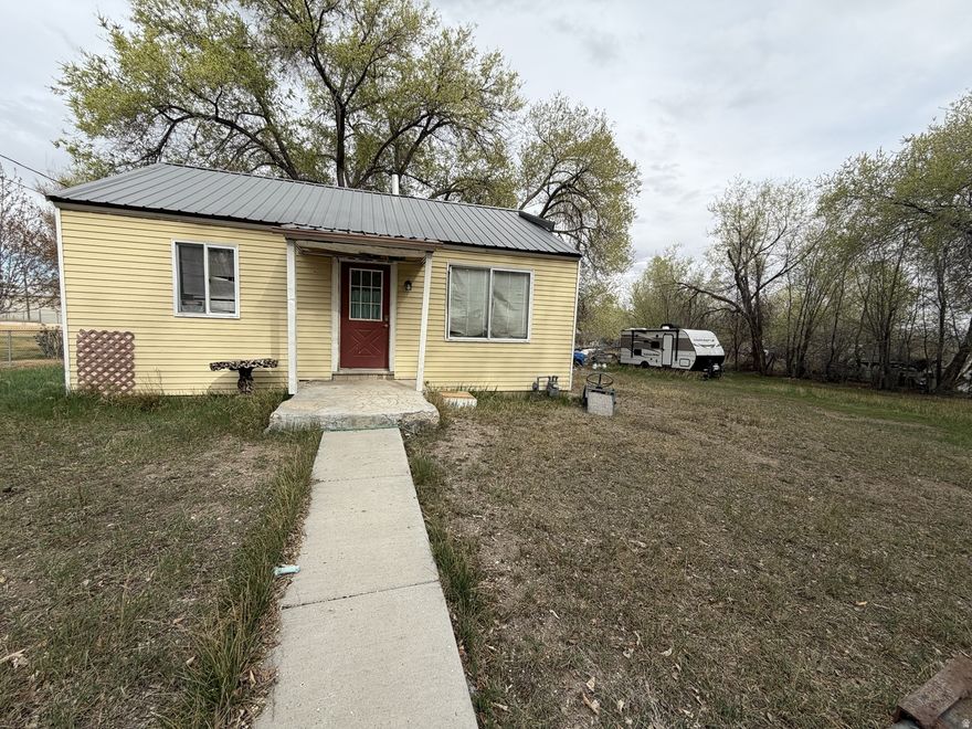 Charming 2 bedroom, 1 bathroom home sitting on a spacious .53 acre lot with endless potential. This property offers the perfect mix of privacy and space, with room for animals, parking, or future improvements. Inside, you'll find a functional layout with natural light and a cozy feel throughout. Fixer Upper, sold as is.