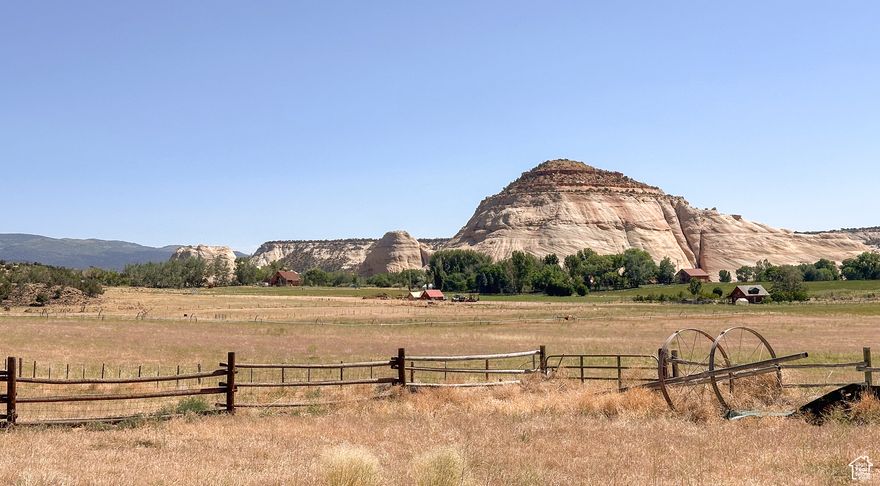 Welcome to Deer Ranch, a gorgeous 80 acre parcel in Lower Boulder with picturesque views in all directions. Rare Find with a Huge Price Reduction! ! Two small cabins- each has 1 bed/ 1 bath and full kitchen. Main home has beautiful log beams, trusses, open floor plan & hardwood floors with a covered front porch for relaxing and watching the sunset after a great day on the ranch. Approx. 30 acres of irrigated alfalfa fields with 30 ''A'' shares of irrigation water. Two wells, one for the cabins & one for a for a future homesite in the NW corner of property.  New septic and electric stubbed to this elevated setting, providing unbelievable views of Sugarloaf and Grand Staircase Escalante Nat'l Monument. Perfect for your future dream home or use now for friends to come stay in their RV's with hookups available.  Located between Bryce Canyon NP & Capitol Reef NP in a beautiful part of So. Utah.  Bring the horses, toys or both. Huge barn with chicken coop, carport, and a large concrete pad with power for future garage or shop. Second home is a sweet ''Tiny Home'' with a cottage feel. Privacy, Large shade trees, green grass, beautiful views, irrigated land - THIS IS A DREAM COME TRUE!    4 wheel lines included.  Potential for lot split or subdivision with City approval. Seller has preliminary concept plans completed - call for details. Fiber is in area, but not completed to property yet. Sq Ft shown is for both properties, both are one level cabins. Occupied, please do not drive through private property -Call for appt. Don't miss this one of a kind property with tons of potential!  See video of the property here- https://youtu.be/iaaOZFjwcG8?si=EcYzbmXXPtCLr2Sk