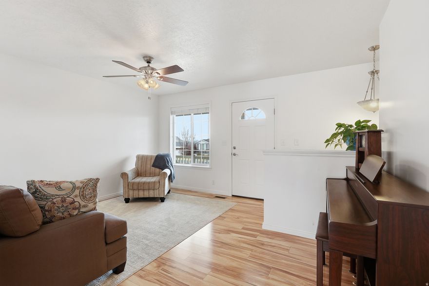 Welcome to this beautiful rambler located on the bench of rural and quiet Richmond. Enjoy the peace and charm of small-town living while still being just minutes from amenities including a new grocery store, pharmacy, and local dining. You're also just a few short minutes from Cherry Peak Ski Resort for great winter recreation, and in the summer, enjoy concerts and live music at the resort. This home has been well maintained, kept clean, and is in excellent condition. The large lot offers plenty of space for gardening, entertaining, or simply relaxing in the fully fenced backyard while enjoying the scenic mountain views of Cherry Peak.