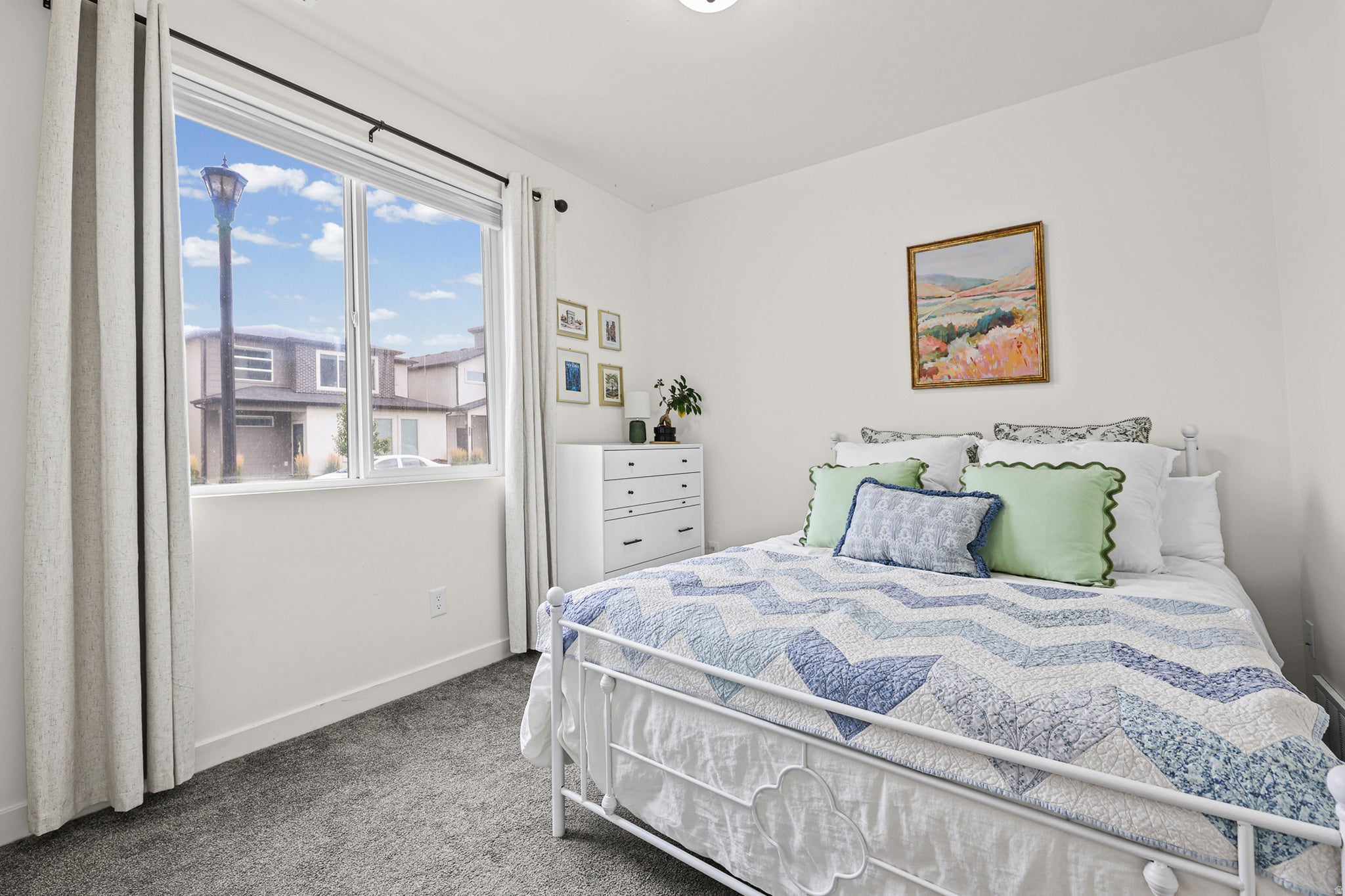 White walls complement the gray carpeting