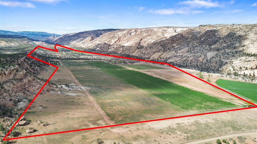 Rare opportunity to own 244 acres in the breathtaking Escalante Valley, set against the area's iconic glowing hills. This well-equipped ranch property includes a home and multiple large, versatile outbuildings.  There is plenty of space for livestock, equipment, and storage. The land has 55 irrigated acres with 72 shares of water, making it ideal for a productive agricultural or ranching operation. Fenced and ready for immediate use, this property provides the perfect blend of functionality, privacy, and scenic beauty. A unique chance to establish your dream operation in one of Southern Utah's most picturesque settings.