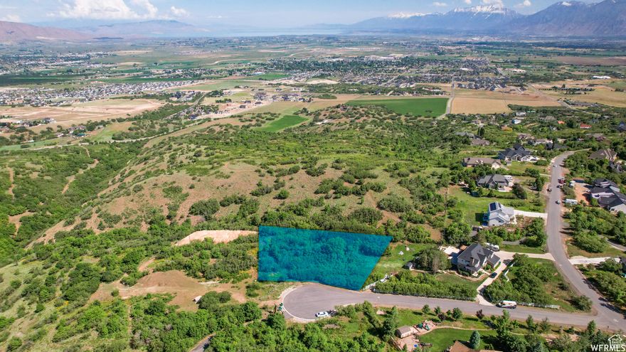 Enjoy the soft touch of nature...Incredible mountain and valley views. The lot is in a cul-de-sac without an HOA. Naturally wooded on an acre lot. Build your custom home with a builder of your choice. Sunsets near enough to touch!