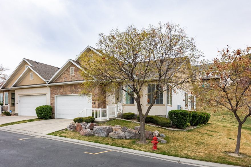 Stunning Wasatch Front views from this refreshed Tithing Hill 55+ gem in Riverton! Freshly painted, new carpet, new deck, and full kitchens on both levels. ~1,550 sq ft per floor with incredible flexibility. Steps from Jordan River Trail, a beautiful park, shopping, and freeway access. Quiet neighbors, unobstructed views, and move-in ready. Rare find - schedule your showing today!