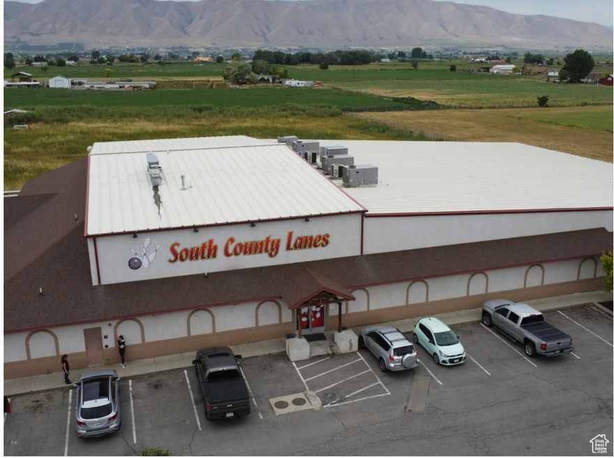 Retail building for sale (potential for industrial use). Currently used as a bowling alley. Approximately 24,963 s.f (22,776 Main and 2,187 2nd Level Office/Storage). Buyer to confirm square footage. Sits on 2.5 Acres. Excellent Freeway Access. Power is 3-Phase 208 Volt. High Amperage Available. Clear Height (Varies from 15'6" to 24') - Note: Girders on lower end are 5'6" tall and drop clear height to 10'. Girders on higher end are about 1'6". Ceiling tiles/etc... in warehouse would need to be removed to get to 24' clear. Zoning is S-1. Can provide to current permitted uses. City might be open to rezone to BPD, I-1, 1-2 for various light industrial/manufacturing uses. 84 Parking Stalls. Sale includes most equipment/furnishings and sold as is.