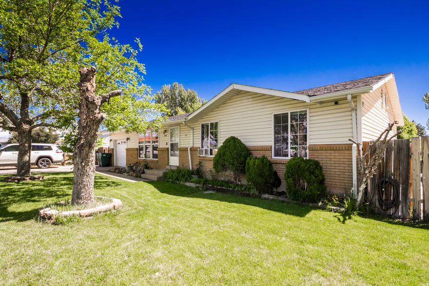 This charming single-level home offers the perfect opportunity for first-time home buyers or anyone looking to downsize without sacrificing comfort or functionality.  The home is filled with natural light that creates a warm and inviting atmosphere throughout. The fully landscaped yard is beautifully maintained and designed for both entertaining and everyday enjoyment, with plenty of space for pets, gatherings, or simply relaxing outdoors. With power already installed in the backyard with a large concrete pad, a future shed, workshop, pool, or additional storage is convenient and easy. With its functional layout, attractive outdoor space, and move-in ready feel, this home is one you won't want to miss. Schedule your private showing today! Square footage per county records. Buyer to verify all including square footage.