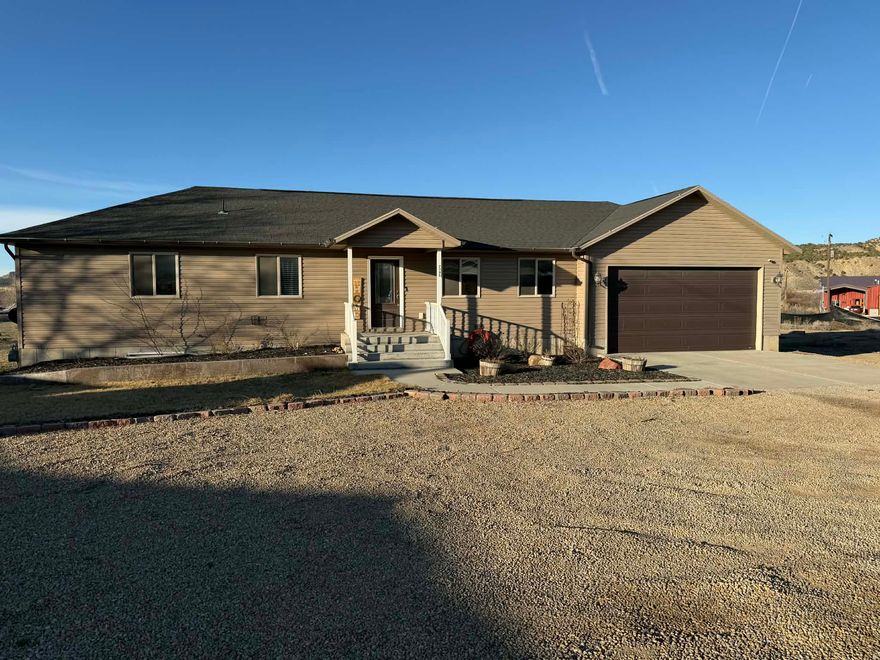 This stunning home sits on 1.42 acres and offers breathtaking mountain and sunset views. The 3-bedroom, 2-bath home is in immaculate condition and has been beautifully maintained. The bright and inviting kitchen features custom cabinetry, granite countertops, and new appliances, making it the perfect space for cooking and gathering.  As you step through the front door, you'll immediately feel at home. The property boasts vaulted ceilings, recessed lighting, walk-in closets, custom blinds, central air, and a Protection 1 security system, along with many other thoughtful upgrades. The home includes an attached two-car garage plus plenty of additional space for RV parking and recreational vehicles. There is also room to grow, with nearly 1,200 sq ft of unfinished basement space ready for additional bedrooms, a bathroom, or a family room. Relax in your private hot tub while taking in the peaceful evening sunsets overlooking Castle Valley from the backyard patio. The beautifully landscaped yard includes a sprinkler and drip irrigation system, along with a greenhouse, vegetable garden, and fruit trees such as plum and apple. This property truly offers the perfect blend of comfort, space, and stunning scenery. Schedule your private showing today!  Square footage figures are provided as a courtesy estimate only and were obtained from Carbon/Emery .  Buyer is advised to obtain an independent measurement.