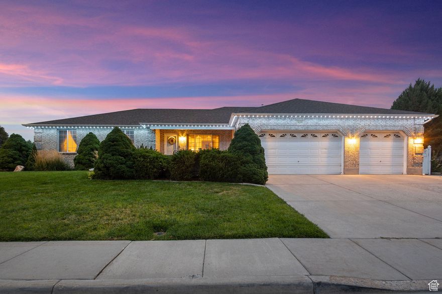 Discover this 5 bedroom, 3.5 bathroom home in West Valley City, featuring a traditional brick exterior that never goes out of style. Inside, you'll find generous living spaces, including a game room and TV room for family nights or casual entertaining. The kitchen and dining area with oak cabinets offers a warm, traditional touch and plenty of room for gathering.  Set on a corner lot, the property includes a large landscaped backyard-perfect for summer BBQs and outdoor fun-as well as a 4-car garage with ample parking and storage. The home has Trimlight LED holiday lights and a central vacuum system! With its blend of timeless curb appeal and functional space, this home is ready for its next chapter.